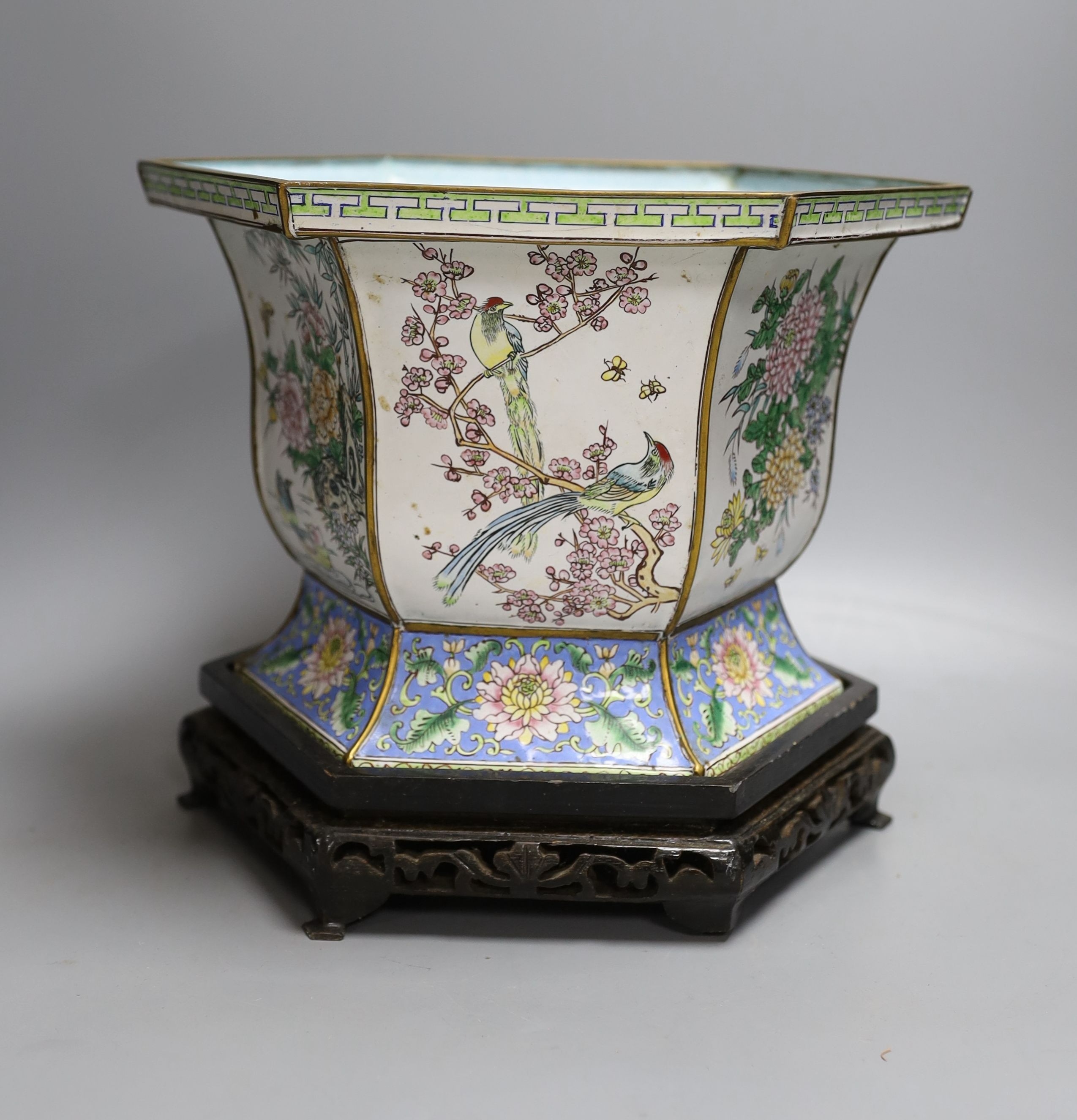 A Chinese Canton enamel jardiniere on hardwood stand, total height 23cm